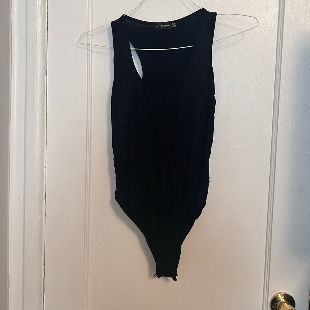 Black, sleeveless, scoop neck body suit. Size medium